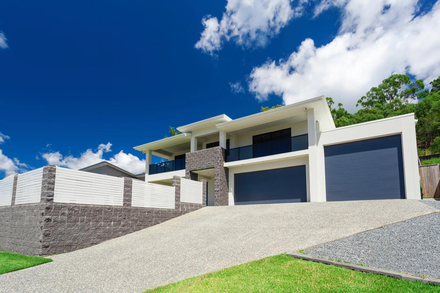 Concrete driveway leading to a home