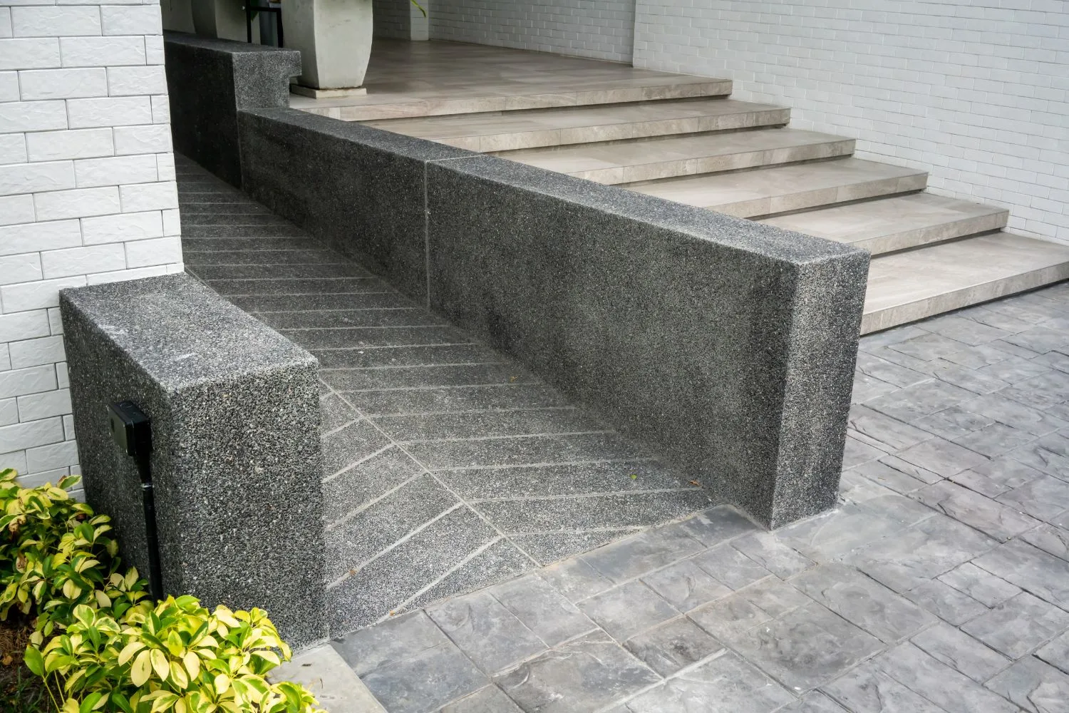 Concrete ramp built for easier access to a property