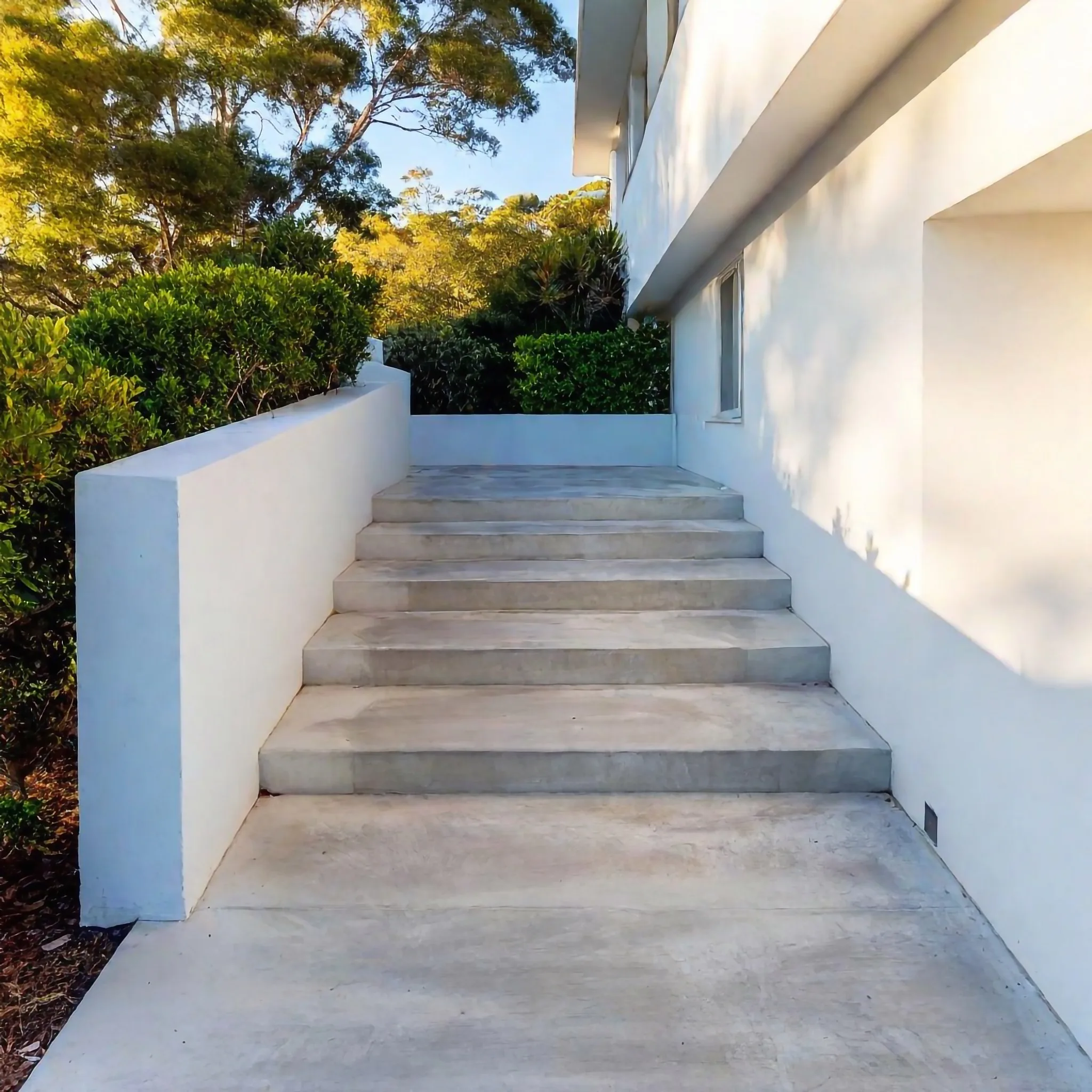 Concrete steps leading up to a home entrance